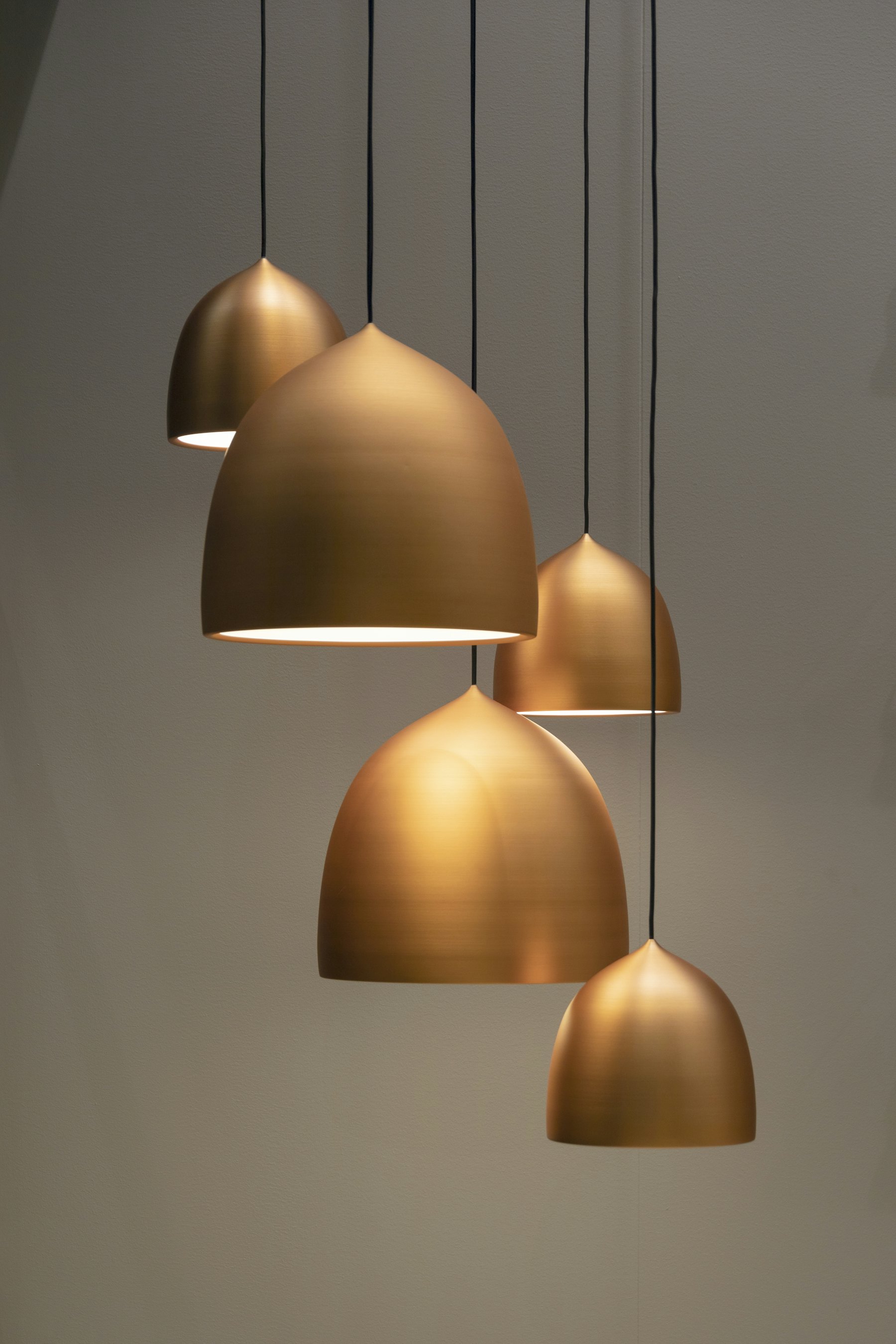 Brushed brass pendant lamps, showing finish and detail