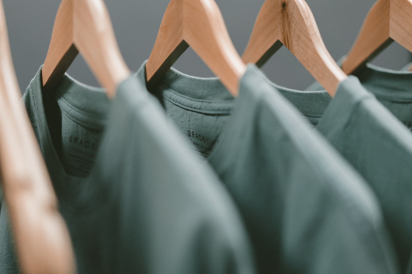 Pressed branded garments on a rail