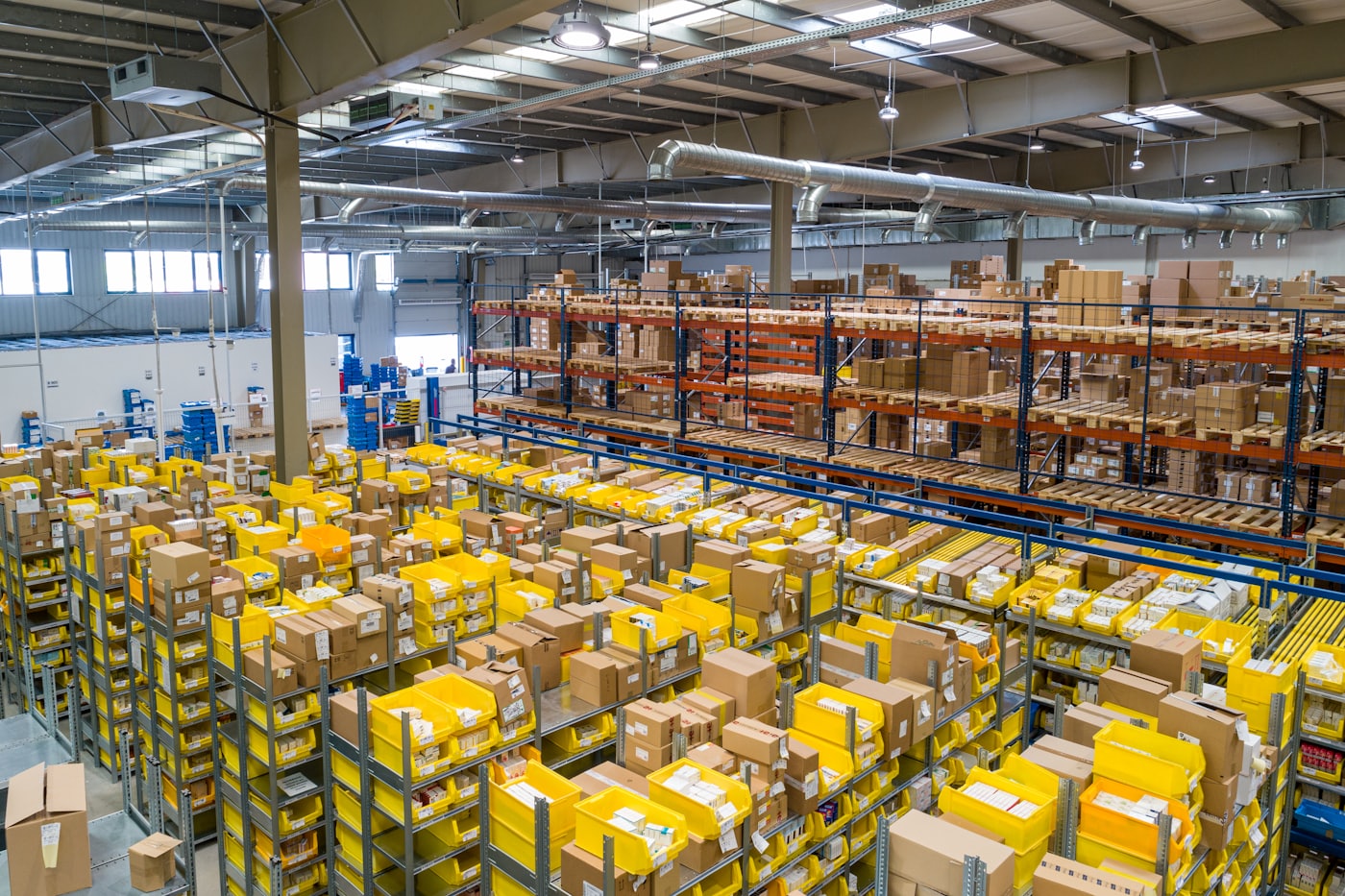 A warehouse floor with stacked crates ready for distribution